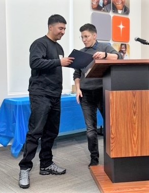 Brandon Sanchez receives award.