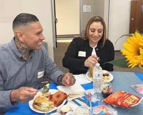 MCRP LA2 Habitat for Humanity awards dinner with two people at a table.
