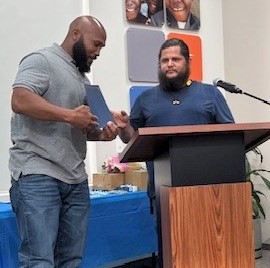 Jurray Casey receives an award.