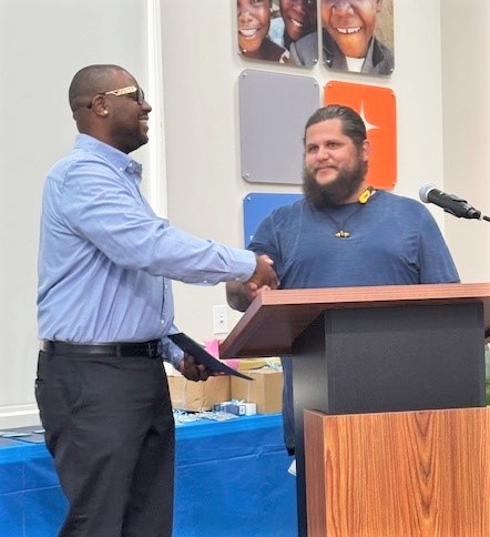 MCRP LA2 Tony Tatum receives an award.