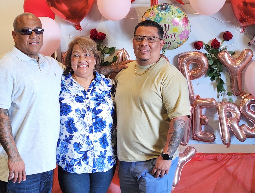 Three people at a Mother's Day visiting event for the Male Community Reentry Program, Los Angeles 2.