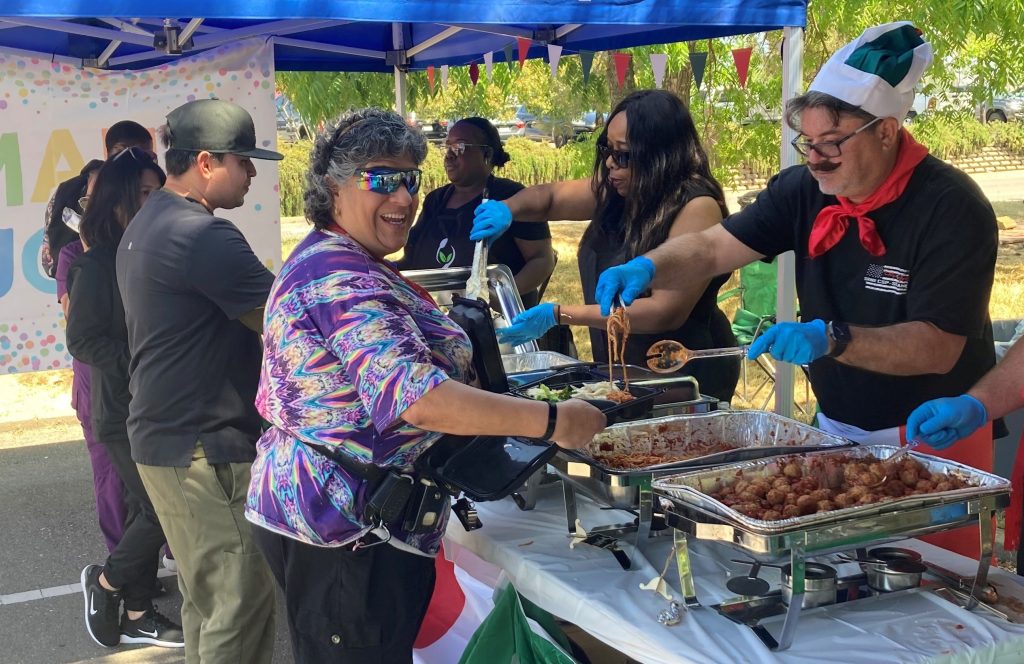 Lisa Burkhart samples Italian food at an appreciation event at Mule Creek State Prison in Ione, California.