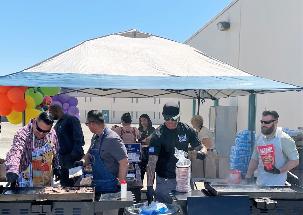 Working the barbecues at the staff appreciation event at CDCR SATF in Corcoran.