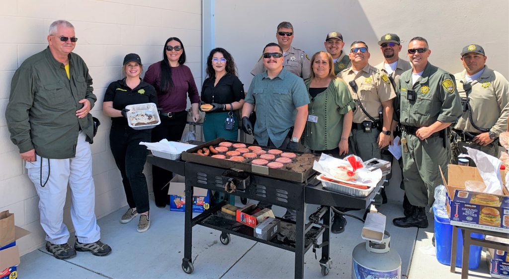 Grilling burgers at the SATF staff appreciation day event.