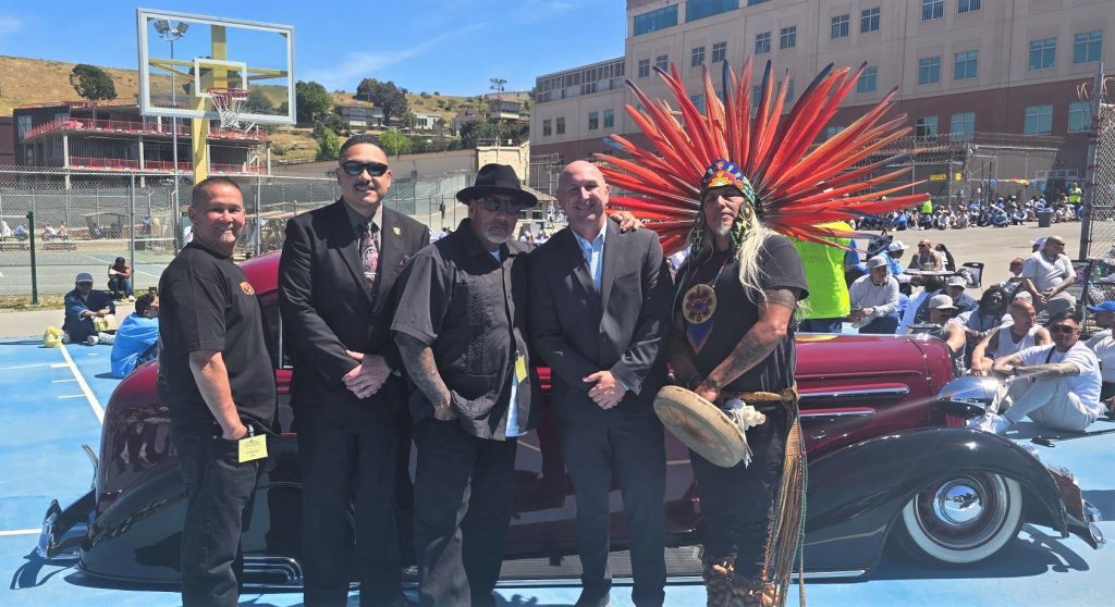 San Quentin Warden Chance Andes with community members and staff.