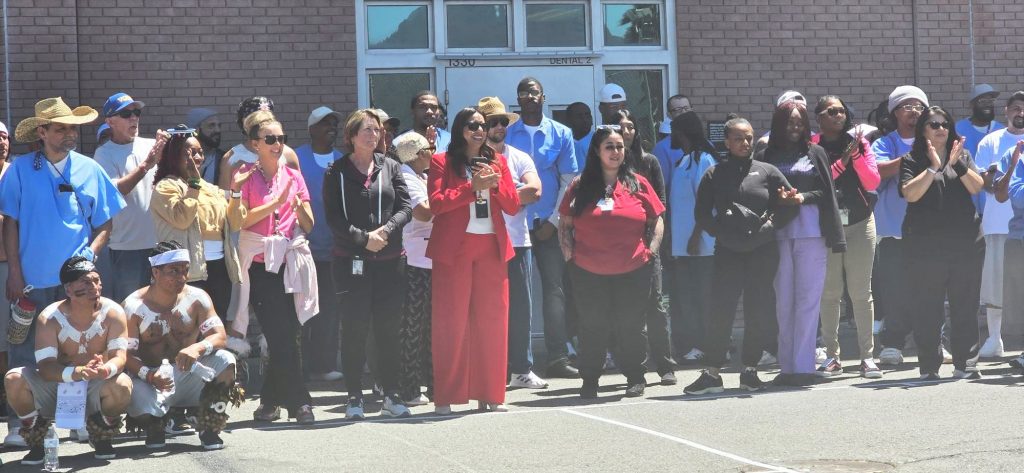 Staff applaud performances during Cinco de Mayo at San Quentin.