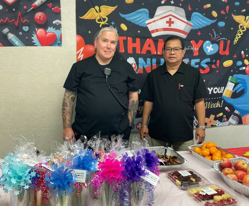 Two people with giveaways at Wasco State Prison.