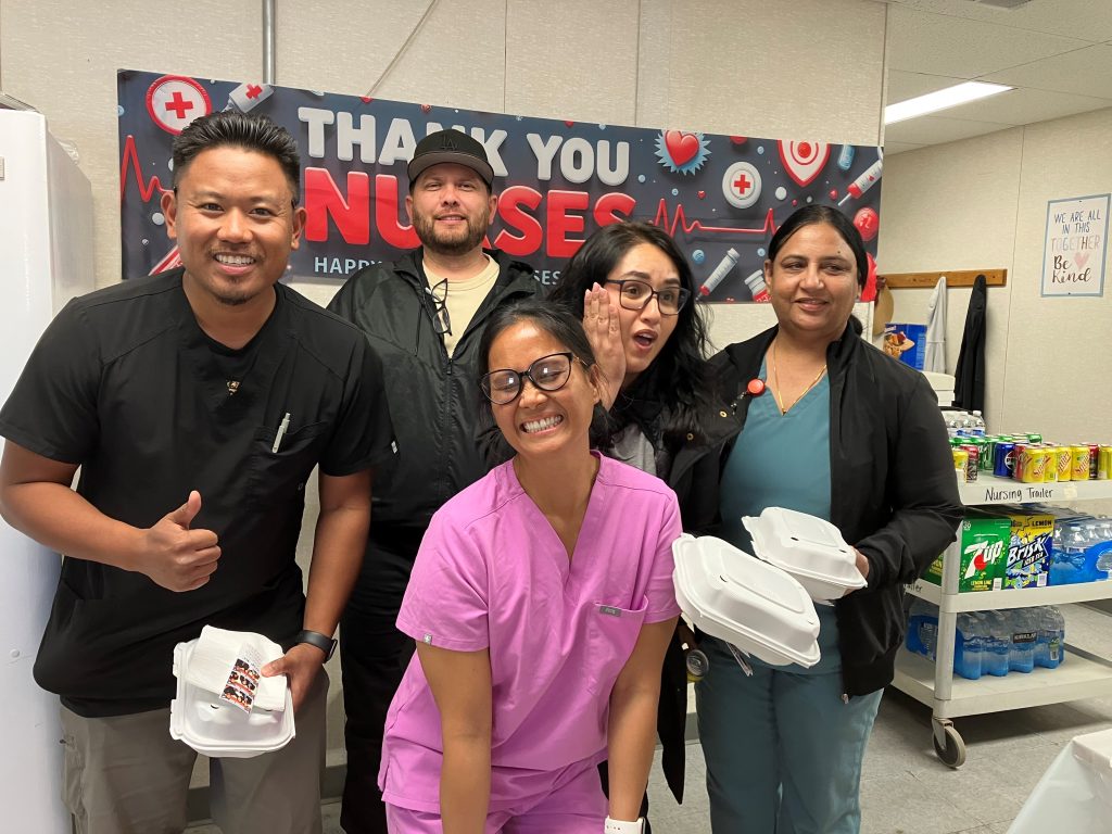 Five people hamming it up for the camera at Wasco State Prison-Reception Center in Delano.
