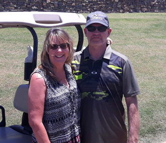 Missy and her husband Kevin at the golf course