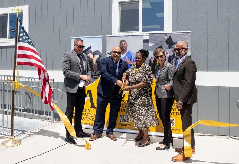 Photo: California Institution for Men's (CIM) Associate Director Travis Pennington, far left, and Warden Eric Mejia join Cal State LA President Berenecea Johnson Eanes, Provost Heather Lattimer, and Prison Graduation Initiative Director Bidhan Roy for the ribbon-cutting ceremony at the CIM College Campus on Tuesday, May 27.  (Credit: J. Emilio Flores/Cal State LA)