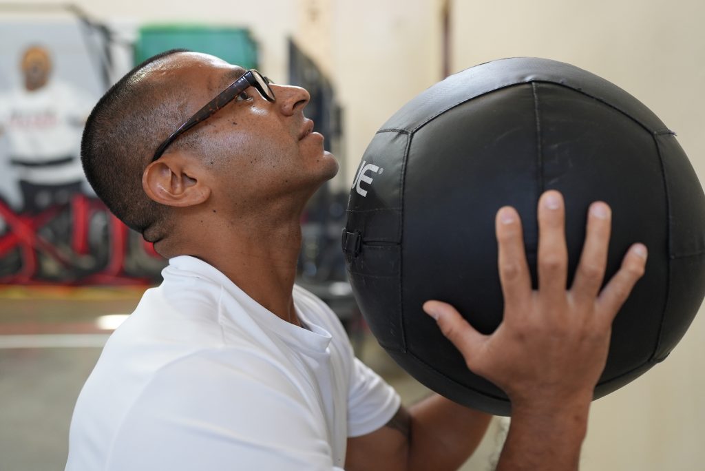Working with a weighted ball for CrossFit at Avenal State Prison.