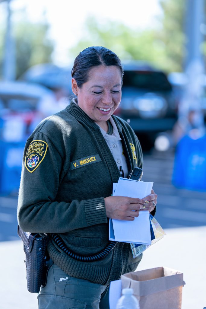 Staff member at an informational booth at CCWF.