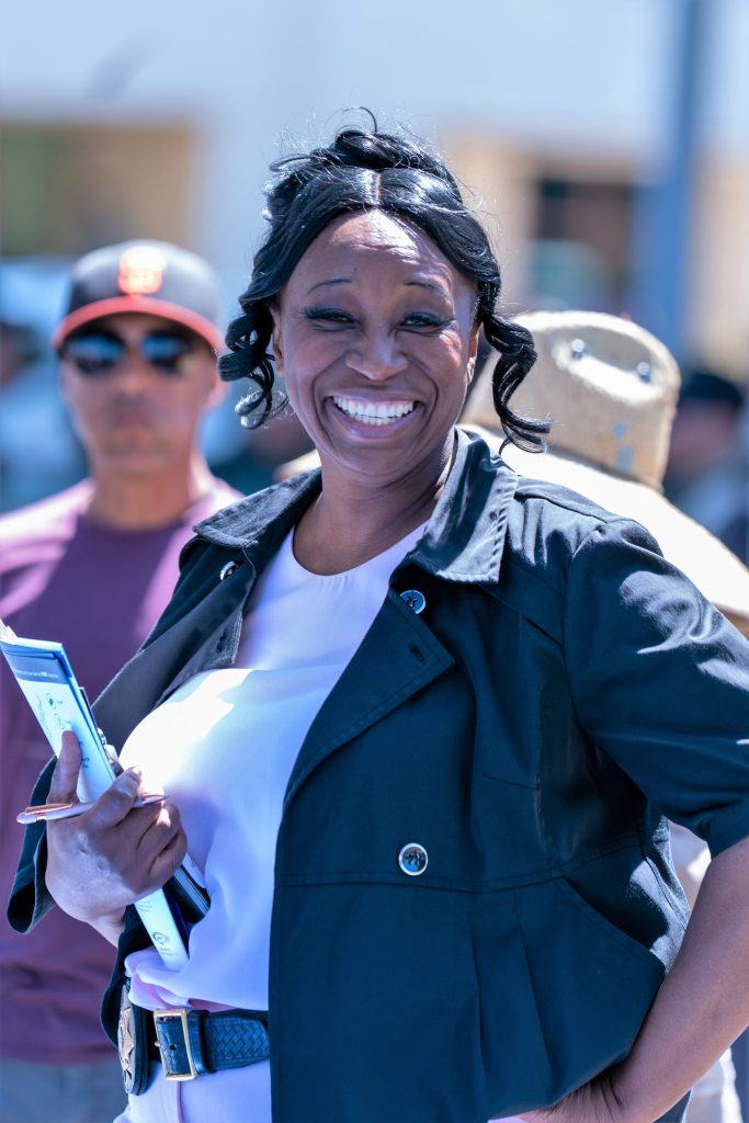 Monique Williams smiling at the camera.