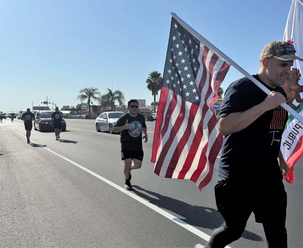Carrying the United States flag in the Law Enforcement Torch Run.