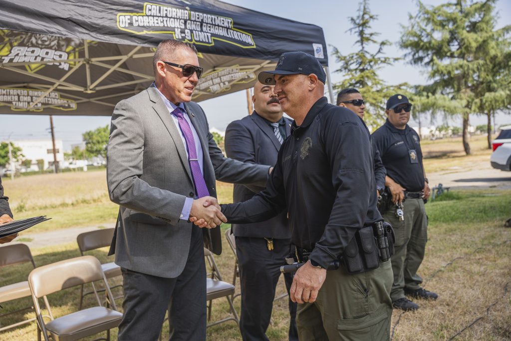 Congratulating officers at CIM in Chino.