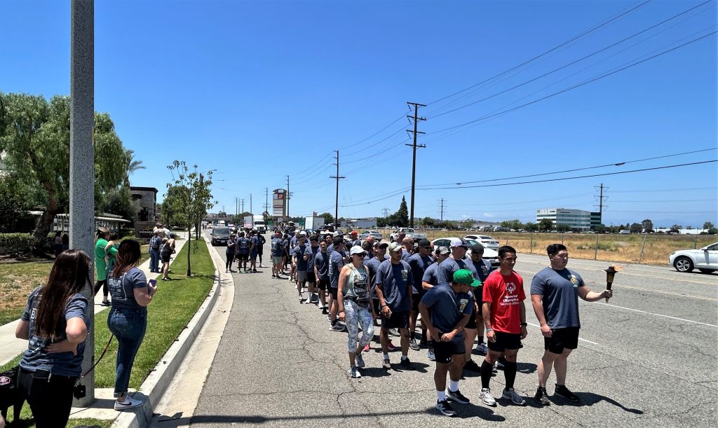 CIW and CIM runners, all CDCR and CCHCS volunteers, wait for the Law Enforcement Torch Run in the city of Chino.