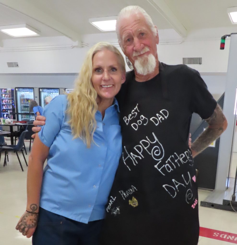 An incarcerated women with her dad at CIW in Corona.