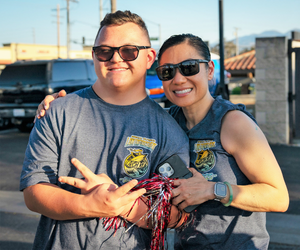 Two people at the CRC LETR torch run 2025.