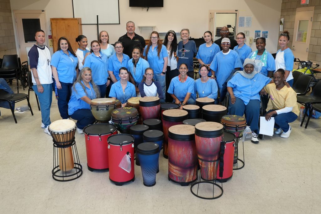 Drums and volunteers with incarcerated people at CCWF in Chowchilla.