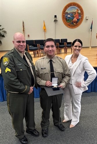 Father and son correctional officers with the CDCR Academy Administrator.