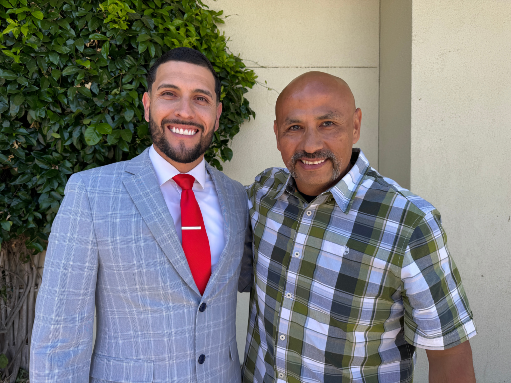 The new parole agent, Mendoza, with his father-in-law.