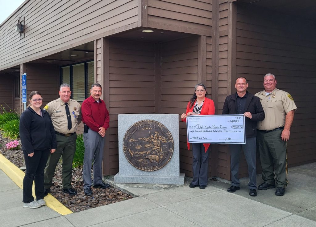 PBSP staff presenting check from food sale