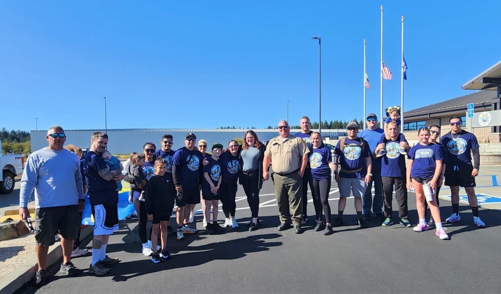 Group photo of Pelican Bay State Prison staff and family members at the Torch Run in Crescent City.