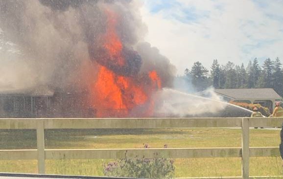 structure fire engulfed in flames