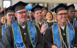 RJD students wear caps and gowns at their University of California, Irvine, graduation wear they earned bachelor's degrees.