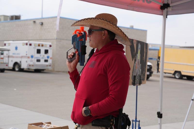 staff wearing cowboy hat for sharpshooter activity