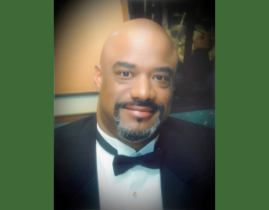 Curtis Rogers, retired associate management auditor, passed away June 9, 2025. He's shown wearing a tuxedo.