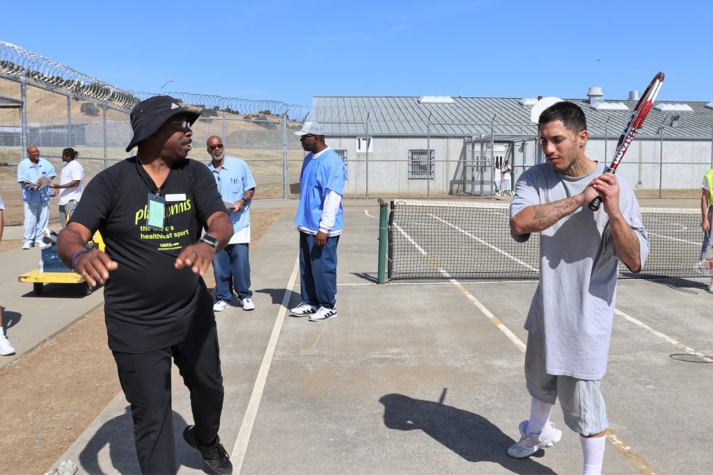 Teaching the basics of tennis at Solano prison.