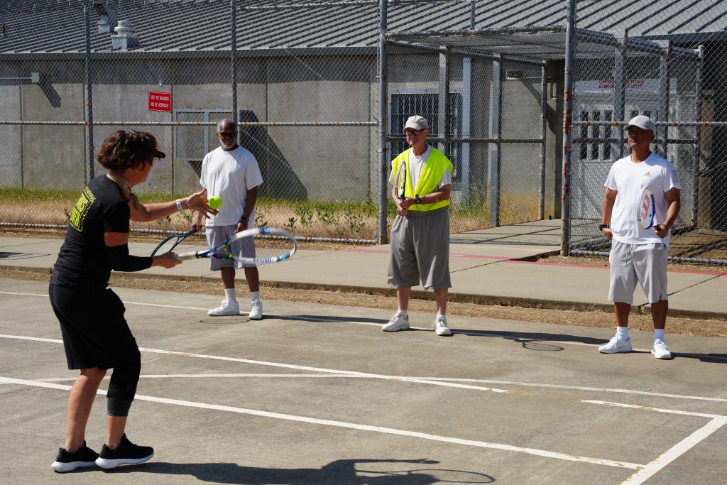 Incarcerated people learn the basics of tennis at CSP-Solano.