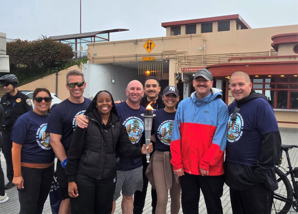 Staff from San Quentin with the Flame of Hope for Special Olympics.