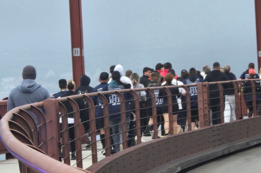 San Quentin staff run across the Golden Gate Bridge during the 2025 Law Enforcement Torch Run benefiting Special Olympics.