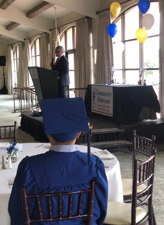 a second chance graduate listening to speech