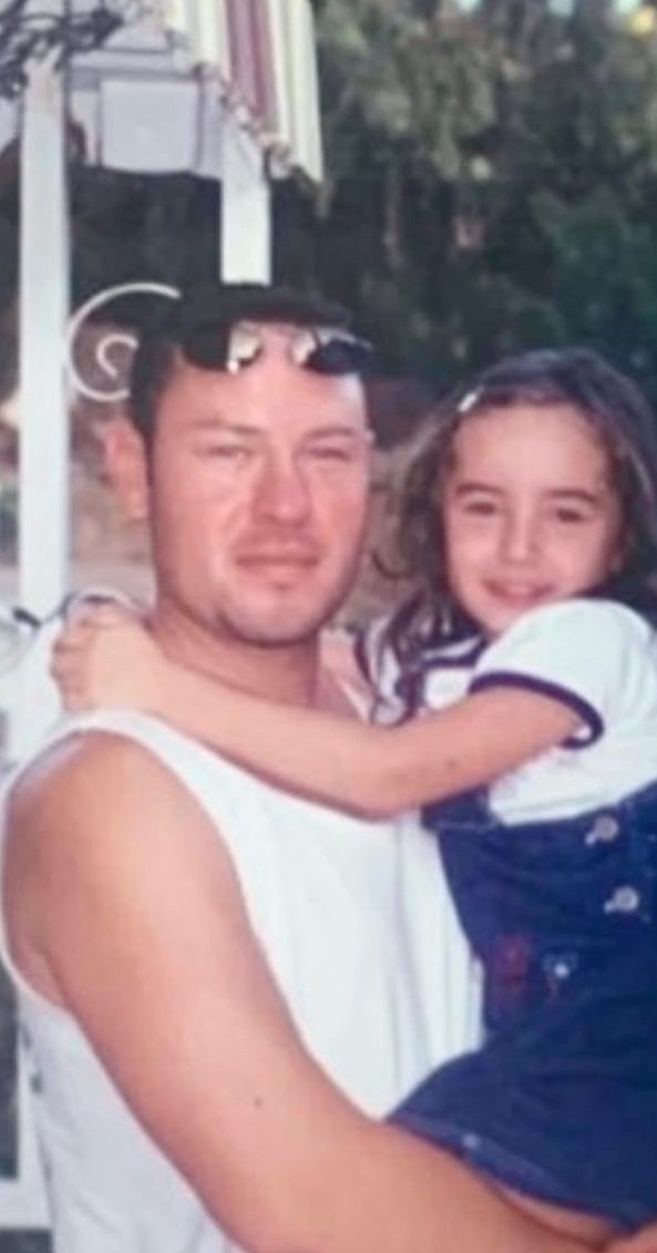 Young Officer Joseph Celis holding daughter Vanessa