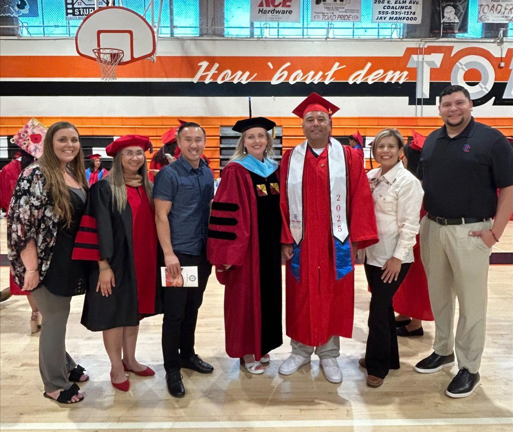 Edward Escalante, formerly incarcerated at ASP at college graduation ceremony with family