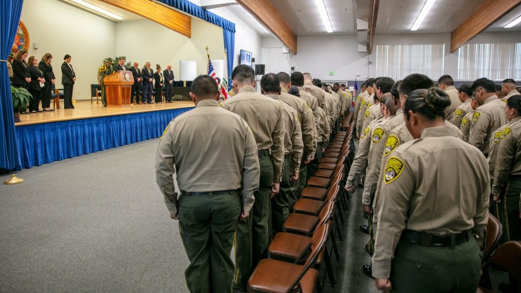 A moment of silence for slain CDCR Parole Agent Joshua Byrd during the graduation ceremony at the Basic Correctional Officer Academy in Galt, California, on Friday, July 18, 2025.