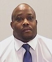 Parole Agent Joshua Byrd staff ID photo.