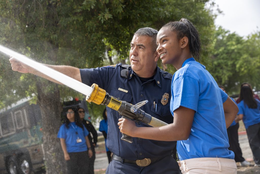 Demonstrating the fire hose at CIM.
