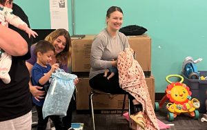 Children at the Community Participant Mother Program received a donation of baby blankets crocheted by the Female Community Reentry Program (FCRP) in San Diego.