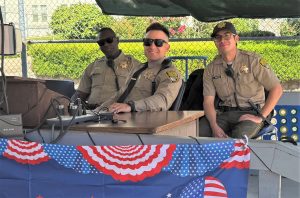 Three staff members at Fourth of July visiting at Folsom State Prison.