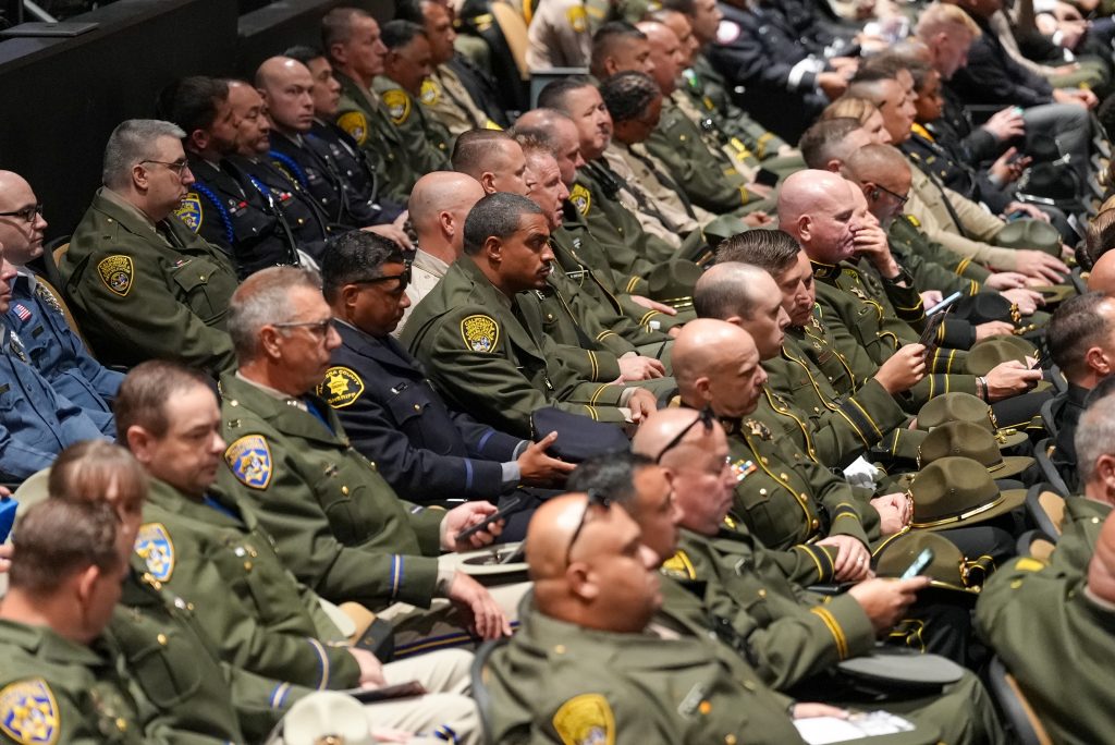 Staff in uniform at the memorial service for Joshua Byrd.