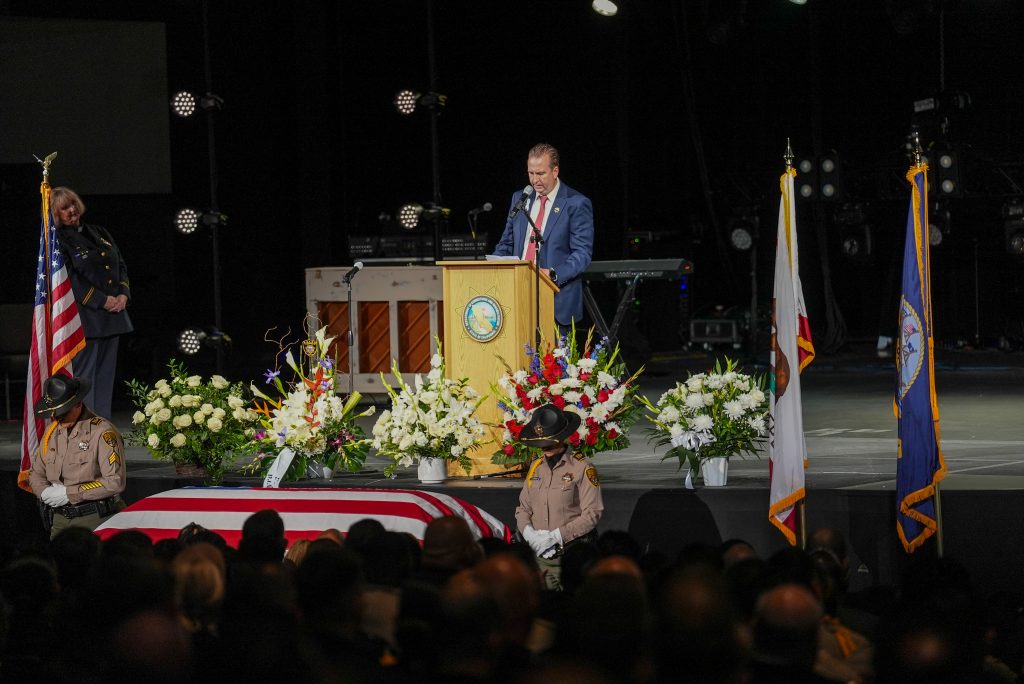 Secretary Macomber speaks during the service.