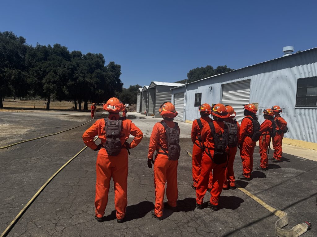 Incarcerated people demonstrate their firefighter training at Puerta La Cruz Conservation Camp 14.