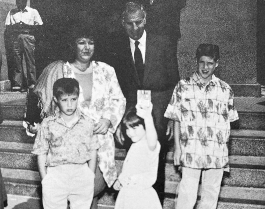 Governor at 1989 Medal of Valor ceremony with Officer Lyle Herman's widow and children.