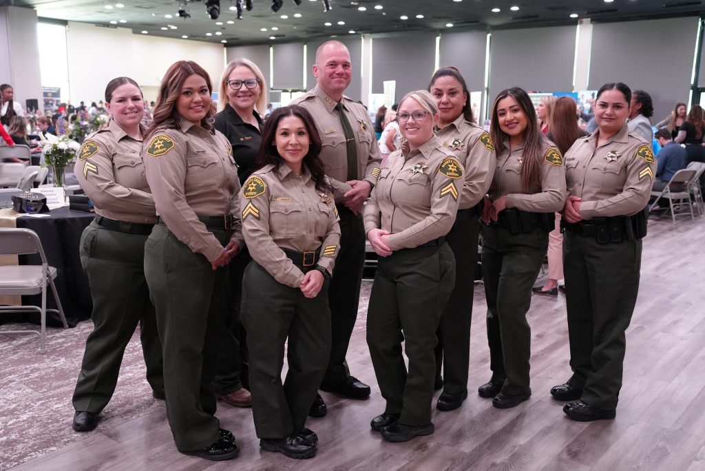 Sheriff and female deputies at the Women in Law Enforcement Symposium.