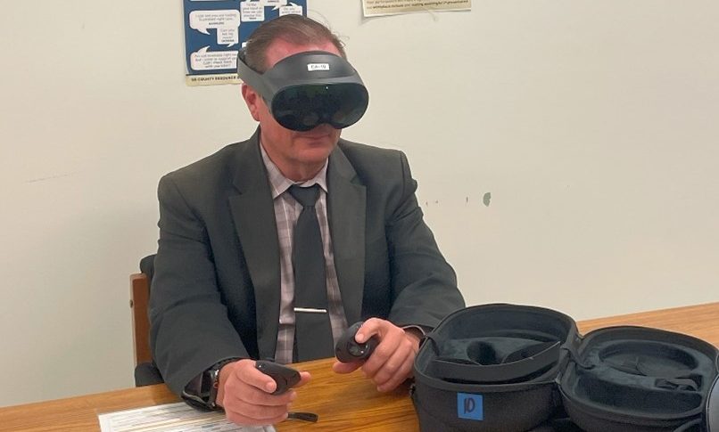 CMC warden checks out the VR program.