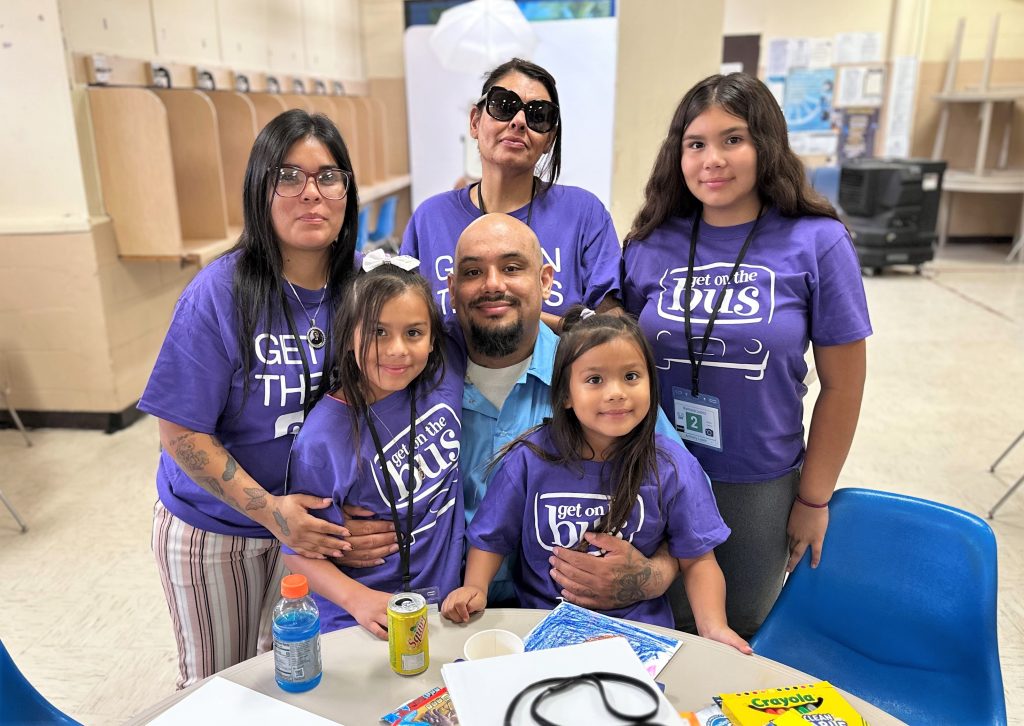 Group photo of a family visiting their incarcerated loved one at CTF-Soledad, Calif., Aug. 2, 2025, during Get on the Bus.